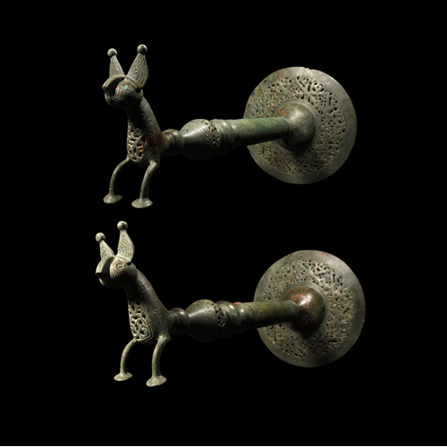 A pair of bronze doorhandles or banner holders